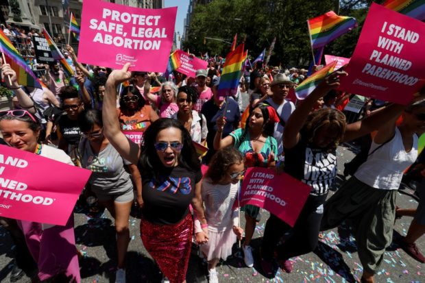 Abortion ruling casts cloud over usual cheer at US Pride parades