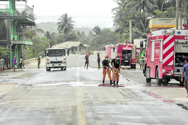 Sorsogon starts clearing ash in highways after Mt. Bulusan spews ash anew on June 12, 2022, Sunday. Photos taken in Juban town, Sorsogon province. STORY: Bulusan erupts anew; ashfall reaches Albay