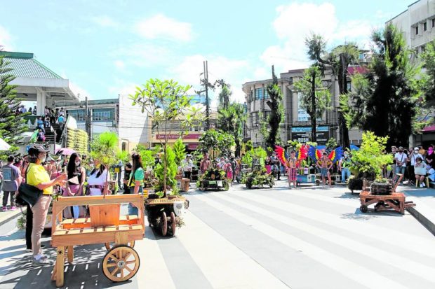 Different types of trees in carts are displayed at Baguio City’s Malcolm Square after a parade on June 18 during the summer capital’s celebration of Saleng Festival. STORY: Baguio execs seek halt to tree-cutting