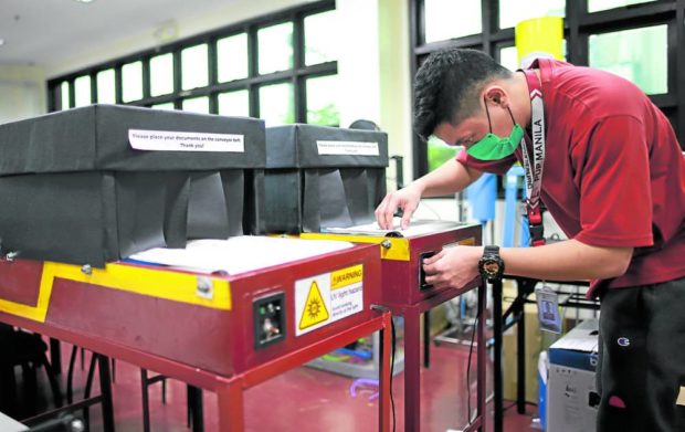 VIRUS KILLER Developed by engineering students of the Polytechnic University of the Philippines (PUP), the ultraviolet disinfection conveyors will first be used at PUP offices, especially those handling large quantities of paper. —PHOTO FROM PUP COMMUNICATION CENTER