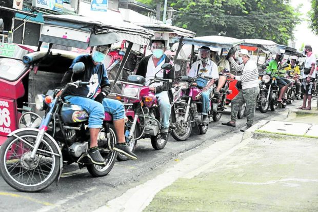 Line of tricycle drivers. STORY: Only half of 1.2 million trike drivers to get fuel subsidy