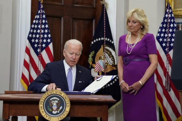 Biden signs gun safety bill into law, takes swipe at Supreme Court
