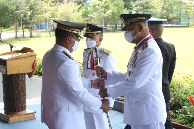 Brig. Gen. Julius Tomines (left), the new acting superintendent of the Philippine Military Academy (PMA), receives the Superintendent Saber fromoutgoing head Lt. Gen. Ferdinand Cartujano in a turnover ceremony on Sunday. STORY: PMA welcomes West Point grad as acting superintendent