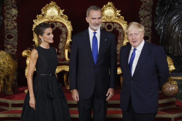 Spain's Queen Letizia, Spain's King Felipe VI and Britain's Prime Minister Boris Johnson pose for pictures before their meeting during the NATO summit, at the Palacio Real in Madrid