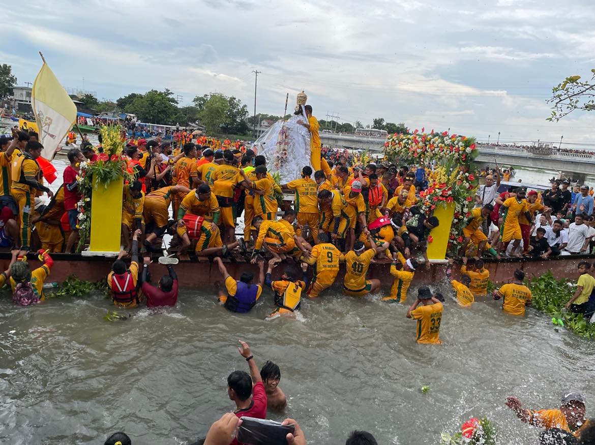 Devotees join the fluvial parade in honor of St. Peter on his feast day in Apalit town, Pampanga 