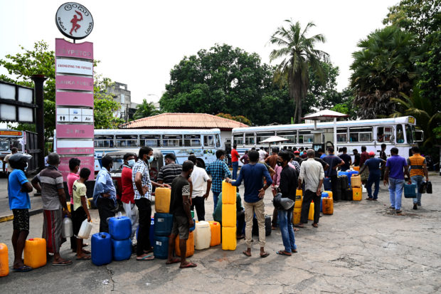 Sri Lankans queue in line for days for petrol without any guarantee of a refill