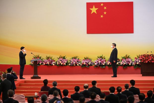 China’s Xi presides over muted Hong Kong handover anniversary