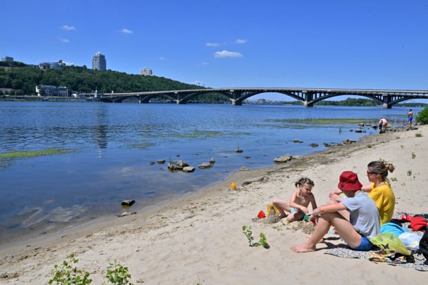 Ukrainians look to Kyiv beaches as respite from war