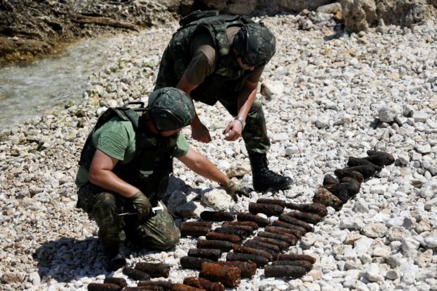 In Albania, divers fish for World War II bombs
