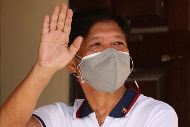 File photo of President Bongbong Marcos waving who on July 8, 2022 tested positive for COVID-19 but his spokesman says he is OK.