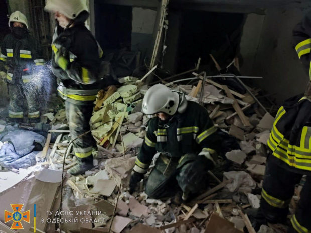 Rescue workers work at the scene of a missile strike at a location given as Bilhorod-Dnistrovskyi, Odesa region, Ukraine, in this handout image released July 1, 2022.? State Emergency Services of Ukraine/Handout via REUTERS