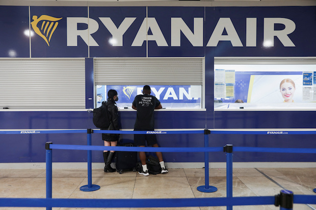 Passengers are pictured in the Ryanair check-in area at the Adolfo Suarez Madrid-Barajas Airport. STORY: Ryanair crew in Spain plan 12 new days of strikes in July
