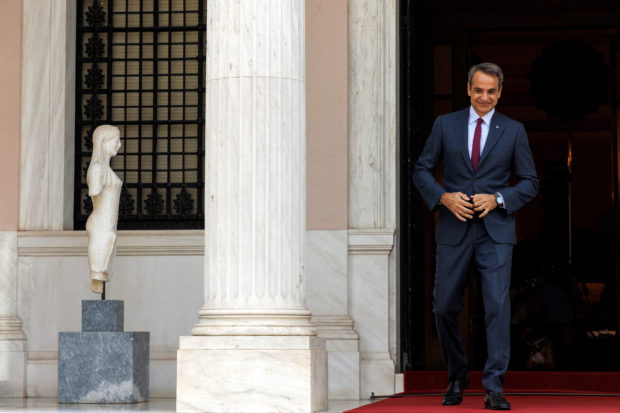 FILE PHOTO: Greek Prime Minister Kyriakos Mitsotakis arrives to welcome his Romanian counterpart Nicolae Ciuca (not pictured), at the Maximos Mansion in Athens, Greece, July 7, 2022. REUTERS/Alkis Konstantinidis