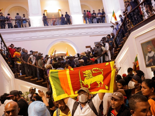 Demonstrators protest inside the President's House, after President Gotabaya Rajapaksa fled, amid the country's economic crisis, in Colombo, Sri Lanka July 9, 2022. REUTERS/Dinuka Liyanawatte