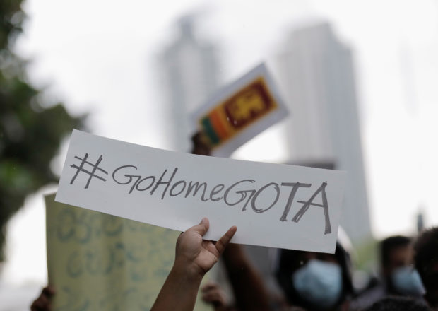 A person holds a placard demanding Sri Lanka's President Gotabaya Rajapaksa to resign after his government lost its majority in the parliament, amid the country's economic crisis