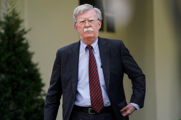 FILE PHOTO: White House national security adviser John Bolton arrives to speak about the political unrest in Venezuela after violence broke out at anti-government protests near Caracas, outside the White House in Washington, U.S., April 30, 2019. REUTERS/Joshua Roberts