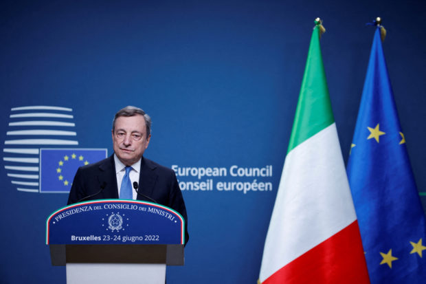 FILE PHOTO: Italian Prime Minister Mario Draghi attends a news conference during a European Union leaders summit in Brussels, Belgium June 24, 2022. REUTERS/Johanna Geron