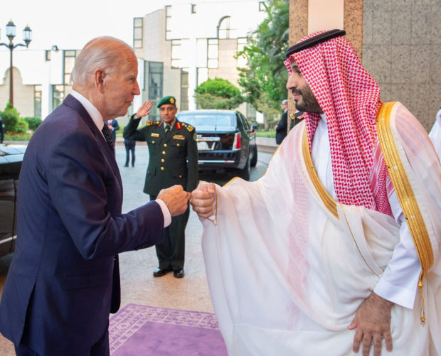 Saudi Crown Prince Mohammed bin Salman fist bumps U.S. President Joe Biden upon his arrival at Al Salman Palace, in Jeddah, Saudi Arabia, July 15, 2022. Bandar Algaloud/Courtesy of Saudi Royal Court/Handout via REUTERS