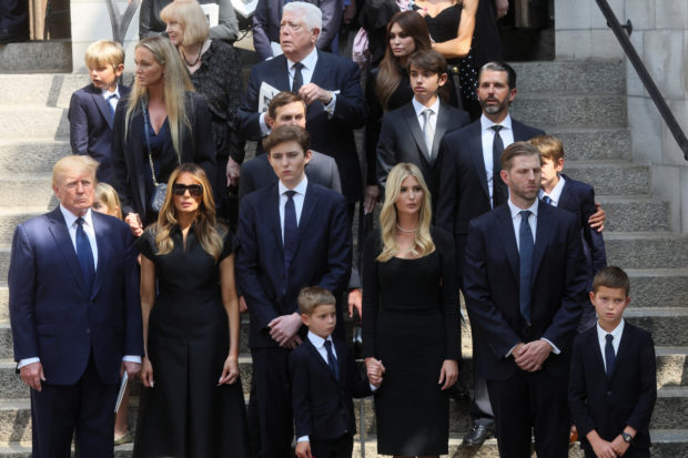 Former U.S. President Donald Trump, his wife Melania, his sons Barron, Eric and Donald Jr., his daughter Ivanka, her husband Jared Kushner and designer Dennis Basso leave St. Vincent Ferrer Church during the funeral of Ivana Trump, socialite and Trump's first wife, in New York City, U.S., July 20, 2022. REUTERS/Brendan McDermid