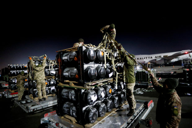 Ukrainian service members unpack Javelin anti-tank missiles, delivered by plane as part of the U.S. military support package for Ukraine, at the Boryspil International Airport outside Kyiv, Ukraine February 10, 2022.  REUTERS/Valentyn Ogirenko
