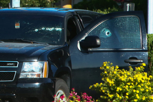 A vehicle with bullet holes visible on the windshield is seen after authorities alerted residents of multiple shootings targeting transient victims in the Vancouver suburb of Langley, British Columbia, Canada July 25, 2022.  REUTERS/Jesse Winter