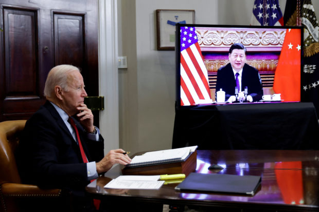 U.S. President Joe Biden speaks virtually with Chinese leader Xi Jinping from the White House in Washington, U.S. November 15, 2021. REUTERS/Jonathan Ernst/File Photo