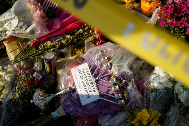 FILE PHOTO: A menorah adorns a memorial for victims of a mass shooting at a Fourth of July parade in the Chicago suburb of Highland Park, Illinois, U.S. July 7, 2022. REUTERS/Cheney Orr