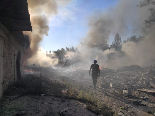 A rescuer walks among debris at a site of a residential area destroyed by a Russian military strike, as Russia's attack on Ukraine continues, in the town of Toretsk, Donetsk region, Ukraine July 27, 2022. Press service of the State Emergency Service of Ukraine/Handout via REUTERS