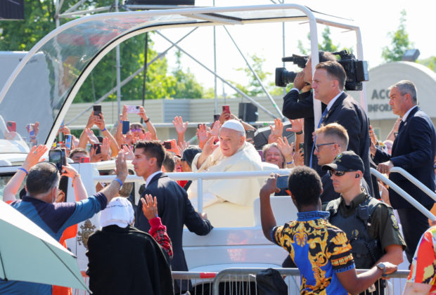 Pope Francis greets the faithful before presiding over a mass at the Shrine of Sainte-Anne-de-Beaupre, one of the oldest and most popular pilgrimage sites in North America, in Sainte-Anne-de-Beaupre, Quebec, Canada July 28, 2022. REUTERS/Christinne Muschi
