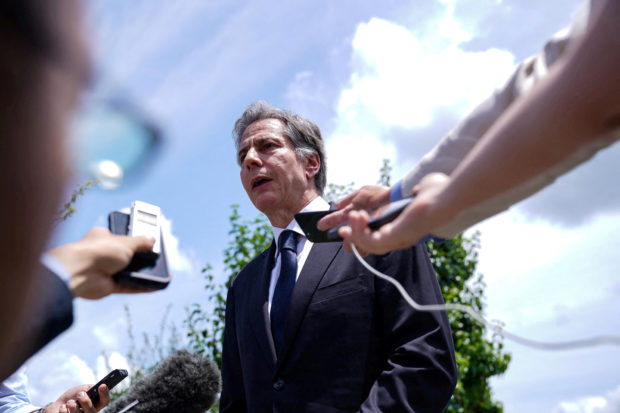 U.S Secretary of State Antony Blinken speaks to the media before boarding his airplane at Yokota Air Base, after a condolence visit for late former Japanese Prime Minister Shinzo Abe, in Fussa, Tokyo prefecture, Japan July 11, 2022.  Stefani Reynolds/Pool via REUTERS/File Photo