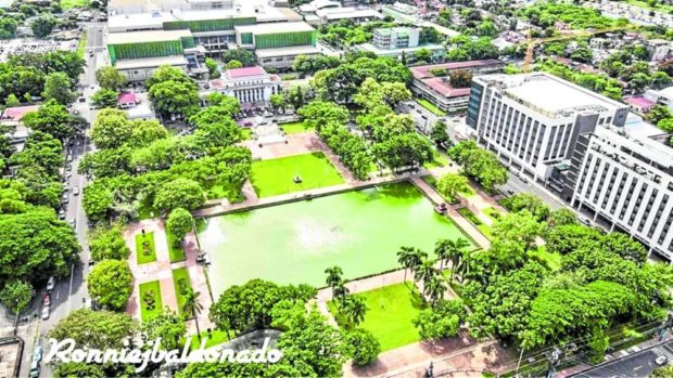 A picturesque scenery of lush greenery right outside the Negros Occidental capitol building in Bacolod City