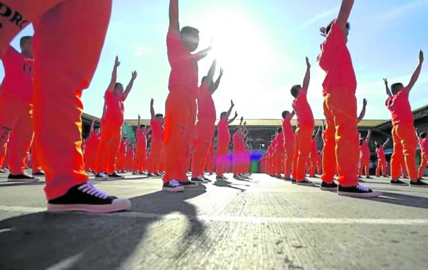 Inmates at Cebu Provincial Detention and Rehabilitation Center perform a dance routine at the jail quadrangle in this 2019 photo. Cebu’s “dancing inmates” have attracted tourists after their first performance video, uploaded on YouTube in 2007, gained millions of viewers. STORY: Cebu governor brings back ‘dancing inmates’ show