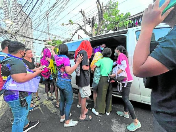 Personnel from the Women and Children’s Protection Center-Visayas Field Unit and other government agencies assist a group of minors
