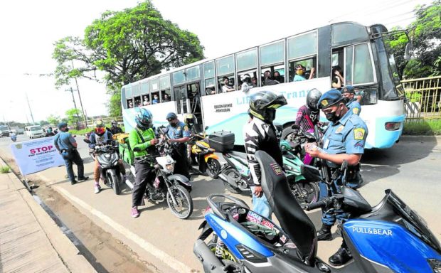 The road to Batasang Pambansa is tightening up, as Quezon City policemen stop motorists along the Batasan-San Mateo Road near the House complex. STORY: ‘Simple, traditional’ SONA with 1,300 guests, director