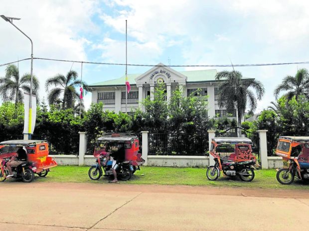 PAYING RESPECTS The Philippine flag at the City Hall of Lamitan in Basilan province is flown at half-staff on Monday to mourn the death of former Mayor Rose Furigay, who was shot and killed by a longtime critic on Sunday. —JULIE S. ALIPALA