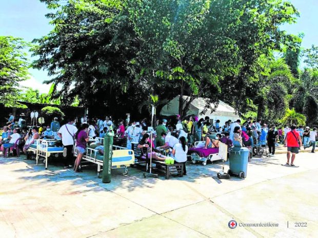 Philippine Red Cross help evacuate patients and staff from the Abra Provincial Hospital. STORY: 7.0 Luzon quake: 5 dead, 1,200 structures damaged