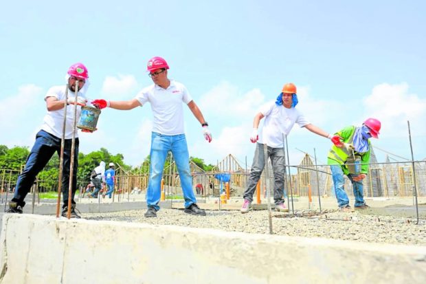 At least 200 volunteers helped build homes for 86 poor families in Silay City