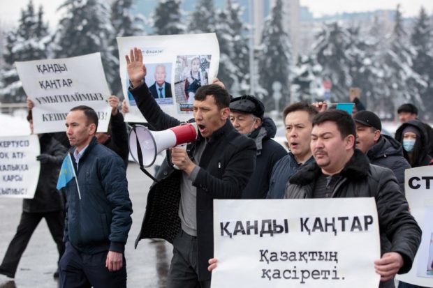 Demonstrators attend a rally in memory of victims of the recent country-wide unrest in Almaty on February 13, 2022.