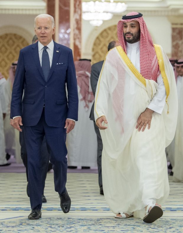 A handout picture released by the Saudi Royal Palace on July 15, 2022, shows Saudi Crown Prince Mohammed bin Salman (R) walking with US President Joe Biden at Al-Salam Palace in the Red Sea port of Jeddah. 