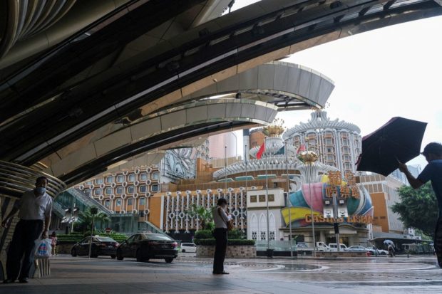 Macau shuts popular shopping mall in race to contain COVID outbreak