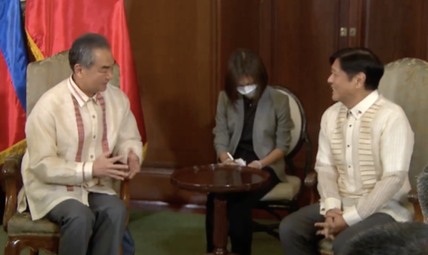 In a screenshot taken from RTVM's livestream on Wednesday, July 6, 2022, Chinese Foreign Minister Wang Yi and President Ferdinand "Bongbong" Marcos Jr. are shown talking with each other during the official's courtesy call.