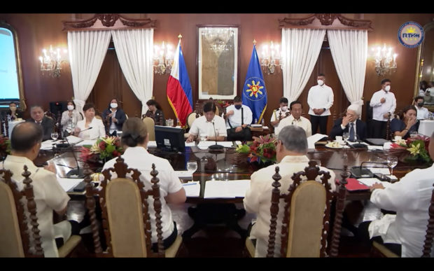 EYES ON THE ECONOMY President Marcos presides over his first Cabinet meeting in Malacañang on Tuesday, telling his officials that the economic managers will set the overall policy that his administration will follow. He is yet to name other members of his Cabinet, including the secretaries for health, environment, science and technology, energy and human settlements. —SCREENGRAB FROM RTVM