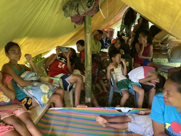 Around 30 individuals are staying in a makeshift tent on Thursday, July 28 in Lagangilang, Abra following the magnitude 7 earthquake. Photo by Daniza Fernandez