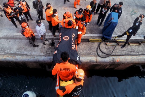 Rescue team evacuate two bodies of victims of the Ladang Pertiwi ferry sinking, at Soekarno Hatta port, in Makassar on June 3, 2022. 