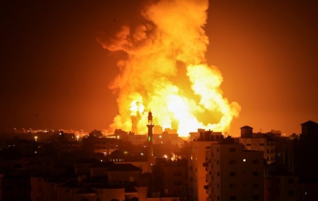 Fires are seen following an Israeli airstrike in Gaza city on July 16, 2022.