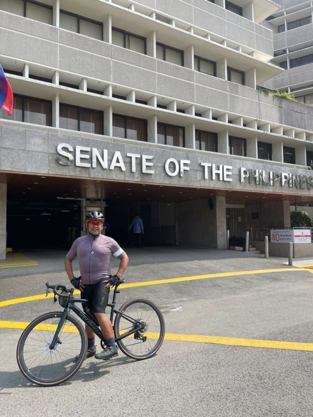 JV Ejercito rode his bike to work, following the opening of the 19th Congress in Pasay City.