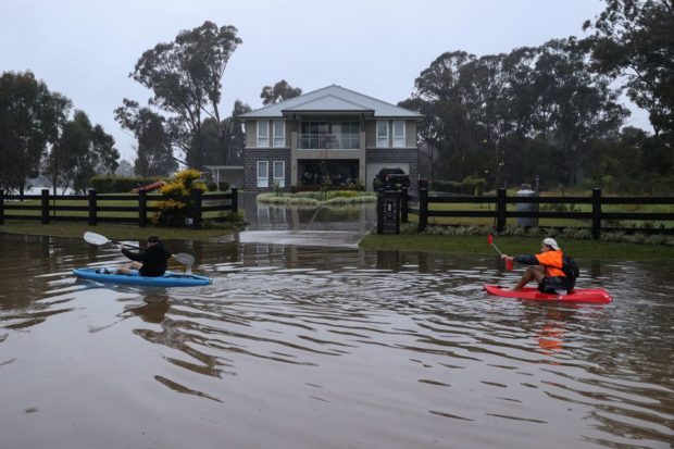 Thousands more evacuate in Sydney even though heavy rains ease