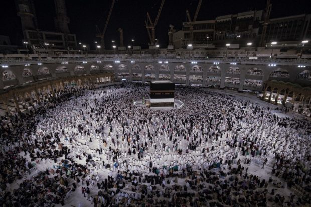 Muslim pilgrims circumambulate around the Kaaba, Islam's holiest shrine, during the annual Hajj pilgrimage at the Grand Mosque in Saudi Arabia's holy city of Mecca on July 6, 2022. One million fully vaccinated Muslims, including 850,000 from abroad, are allowed at this year's hajj in the city of Mecca, a big rise after two years of drastically curtailed numbers due to policies to stop the spread of infection. Delil SOULEIMAN / AFP