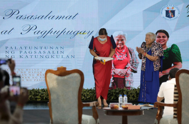 Outgoing Education Secretary Leonor Briones (right) turns over the leadership of the Department of Education to Vice President Sara Duterte during formal rites at the agency’s national office in Pasig City on Monday. STORY: Neda chief: Reopen schools, secure PH kids’ future