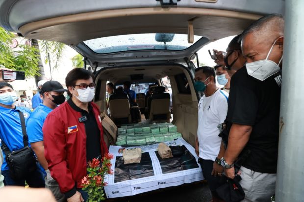 Department of Interior and Local Government Secretary Benjamin Abalos Jr. and Philippine National Police officer-in-charge Vicente Danao Jr. inspect the drugs seized from the Pampanga buy-bust operation on Thursday, July 28, 2022.